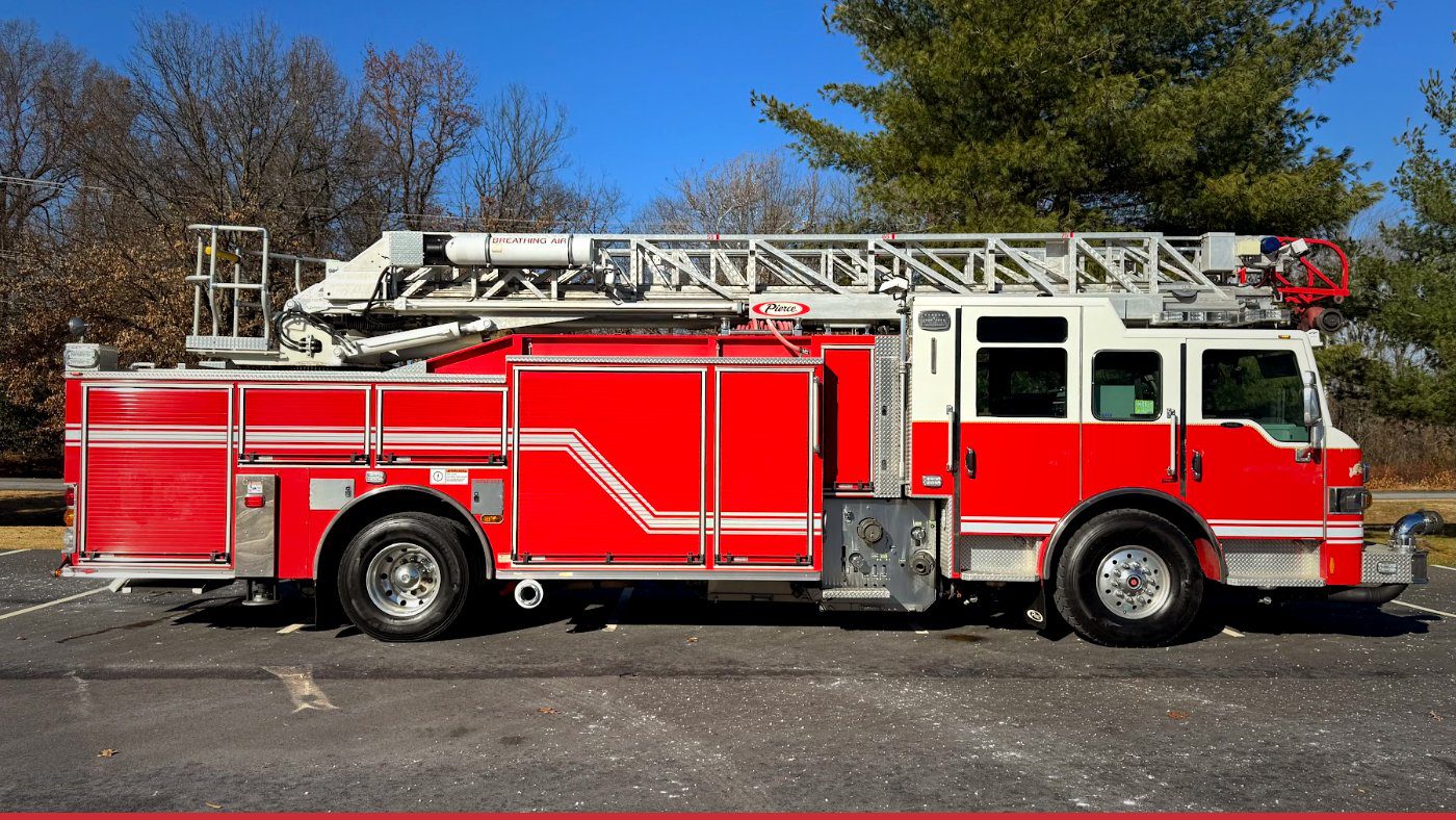 2011 Pierce Velocity used aerial ladder fire truck for sale, side profile showing the ladder, an example of used apparatus with a short fire truck lead time.
